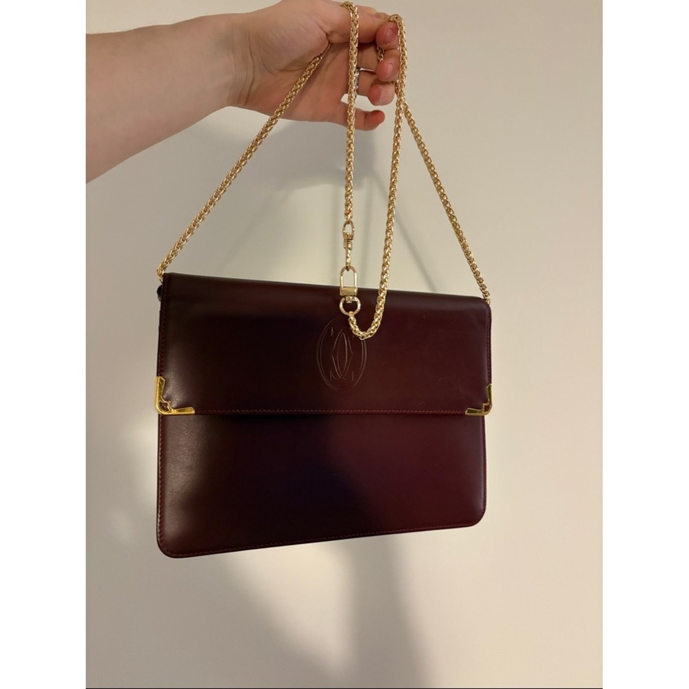 Cartier Burgundy Leather wristlet with Gold Corners‎